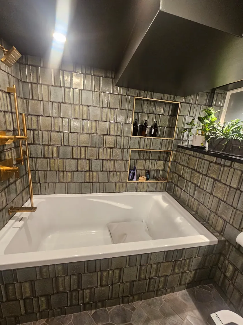 Soaking tub and tiled surround in a Salt Lake City bathroom remodel